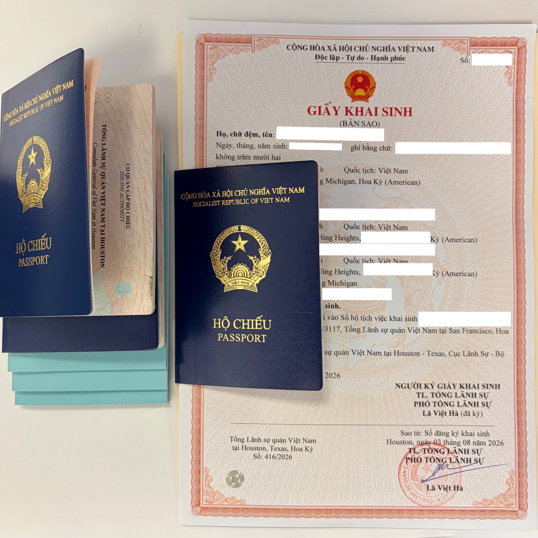 Vietnamese passports and a certified birth certificate copy