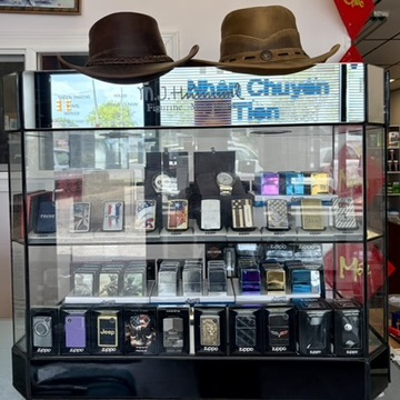Display case with lighters, watches, and gift items